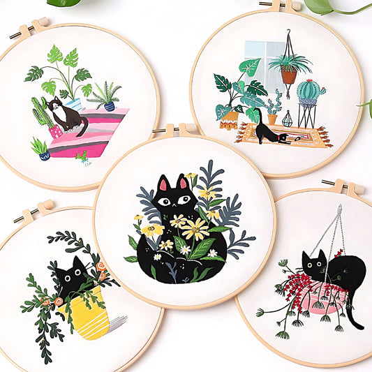 five different black cat embroidery sets on a white background
